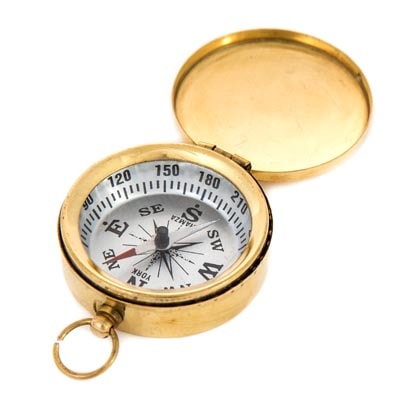 Gold pocket compass on a white background