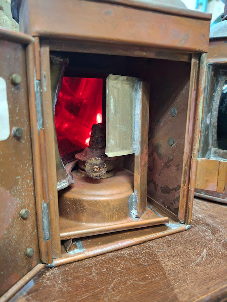 Close-up of an old lantern with a red interior light
