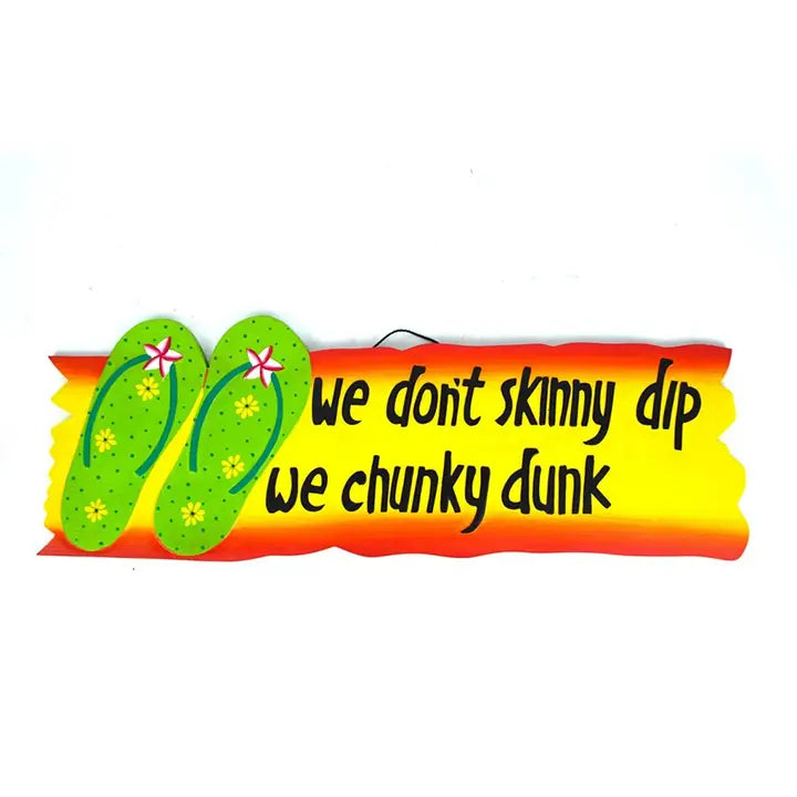 Orange and yellow sign with green flip-flops and text 'we don't skinny dip we chunky dunk' on a white background