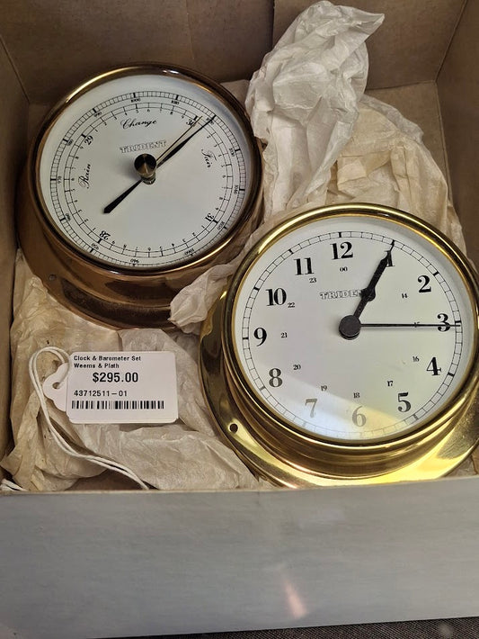 Brass clock and brass barometer in a box with tissue paper