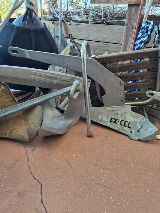 Metal Excel 47lb Anchor with a swimstep and bouy in background