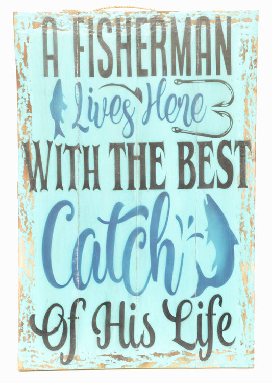 Decorative sign with fishing-themed text and fish illustrations on a light blue background.