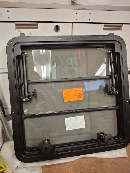 Black framed boat hatch with labels on a white background