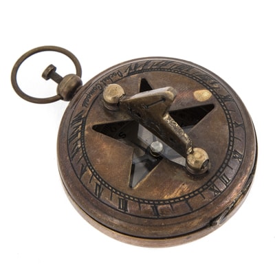Vintage-style brass compass on a white background
