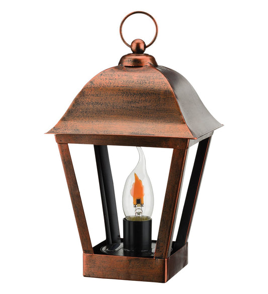 Copper lantern with a lit bulb on a white background