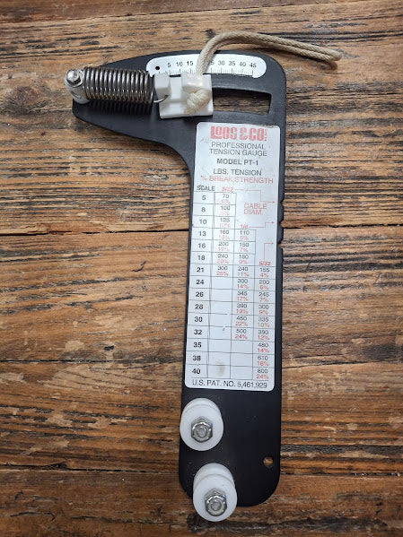 Tension gauge on a wooden surface