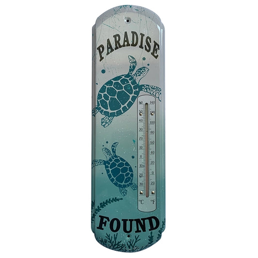 Decorative thermometer with turtle design and 'Paradise Found' text on a white background