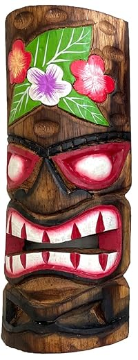 Wooden tiki mask with floral decorations on a wooden background