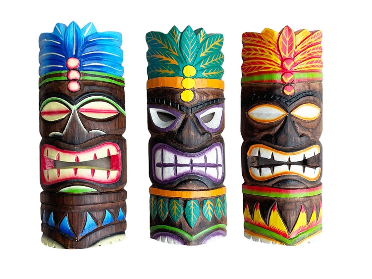 Three colorful tiki masks with vibrant designs on a white background