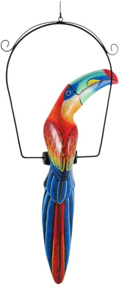 Colorful toucan on a hanging swing with a white background