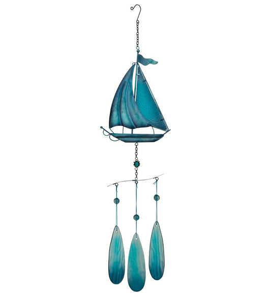 Decorative sailboat wind chime with blue and green colors on a white background